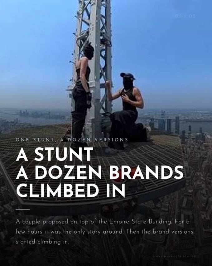 A couple on top of an Empire State Building antenna tower, dressed in black with masks, holding onto the structure at sunrise over the New York skyline.